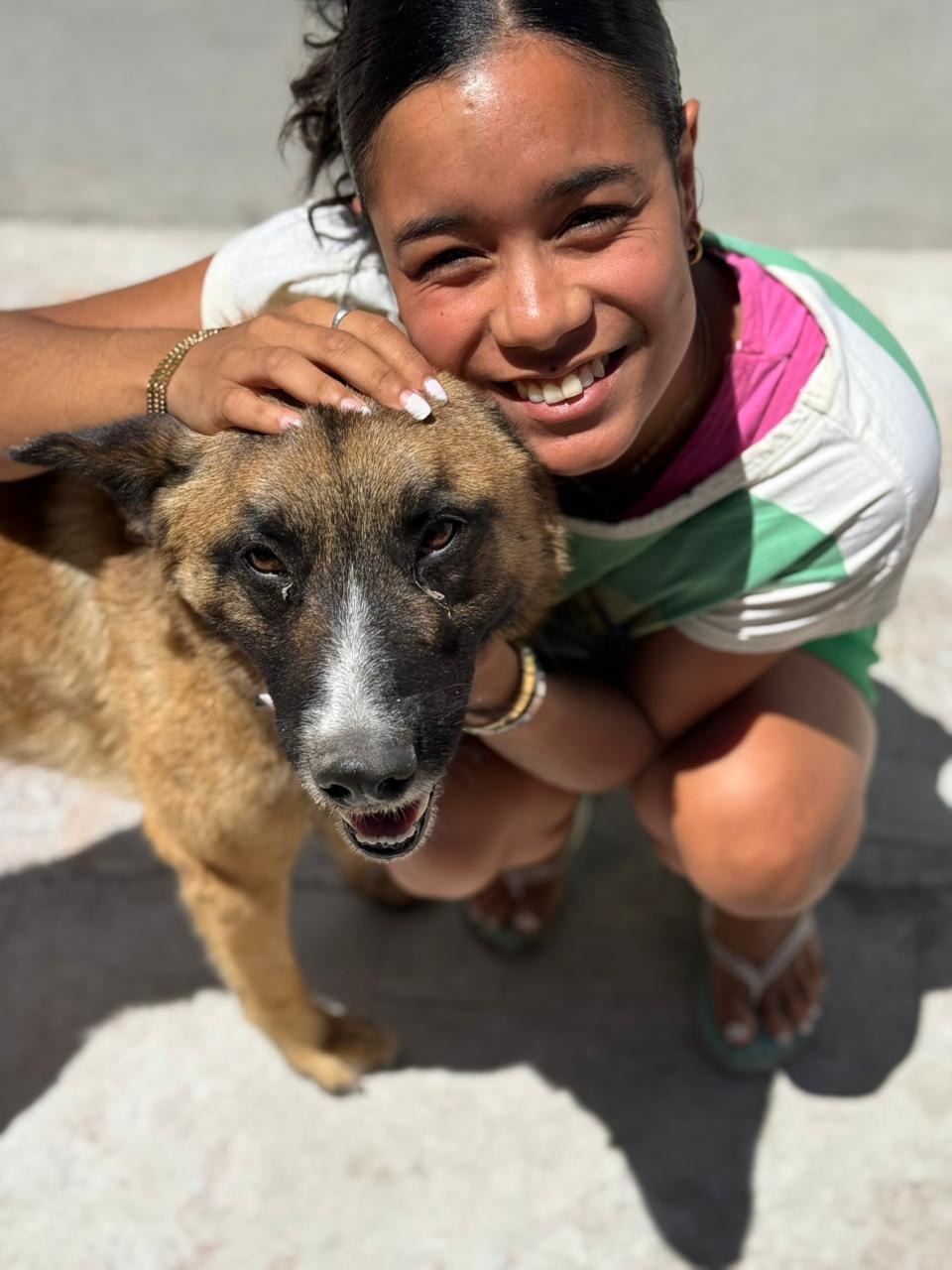 Cute sitter with white nails and a big smile