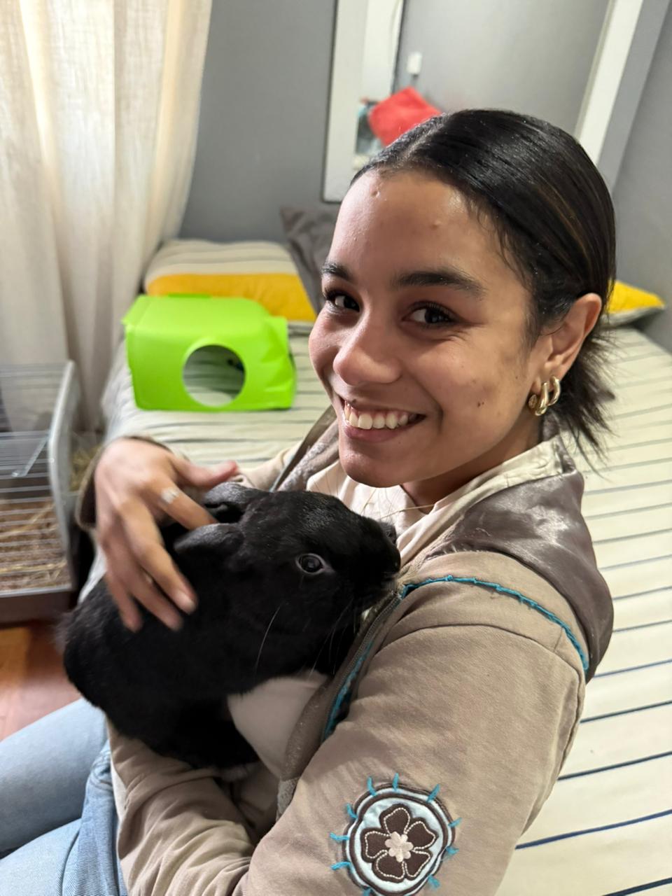 Chasidy Sitter with a wide smile and a bunny