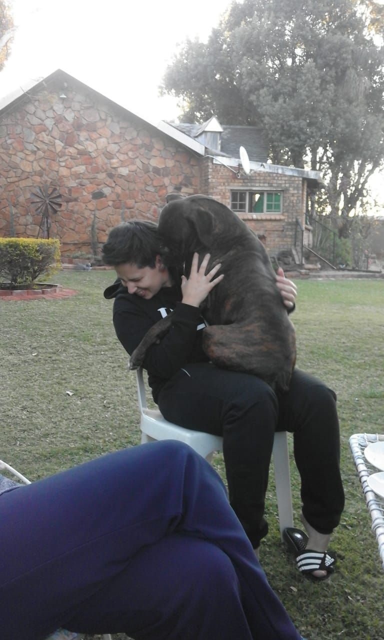 Danielle sitter with large breed puppy on her lap