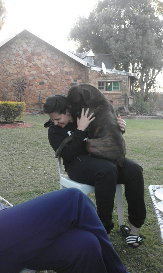 Danielle sitter with large breed puppy on her lap